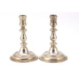 Asprey & Co, pair of silver circular based candlesticks, London 1956, 16.5cm high, 717.2g