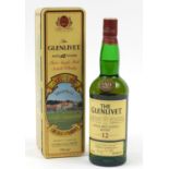 Bottle of Glenlivet twelve years old whiskey with Classic Golf Courses case