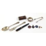 Objects including silver fork, spoon and sugar tongs, enamelled badges and a vintage fountain pen