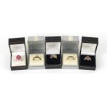 Five silver rings set with semi precious stones housed in gift boxes, various sizes, 23.4g