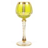 Attributed to Moser, Bohemian green overlaid wine goblet gilded with foliage, 21cm high