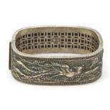 Chinese silver coloured metal phoenix and dragon design bangle, 7cm wide