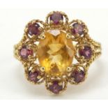 9ct gold orange and purple stone ring with rope twist shoulders, size O, 3.7g