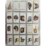 Collection of vintage cigarette cards, predominantly Players and Will's arranged in folders and