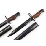 Two military interest No 5 bayonets with scabbards, each impressed FRI to the blades, each 31.5cm in