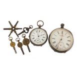 Two silver open face pocket watches with a selection of watch keys, including a Kendall & Dent