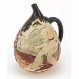 Ciboure, French pottery stylised jug, hand painted with figures playing basque pelota, 18.5cm high