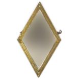Diamond shaped wall mirror with embossed brass border and bevelled glass, 44cm x 25cm