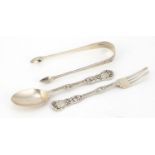 Victorian silver christening fork and spoon and a pair of Georgian silver sugar tongs, the fork