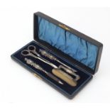 Adie & Lovekin Ltd, Edward VII silver four piece manicure set housed in a velvet and silk lined