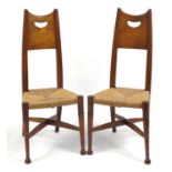 Pair of Arts & Crafts elm side chairs with rush seats, 105cm high