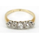 Unmarked gold graduated diamond five stone ring, size J, 2.3g