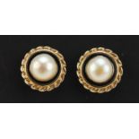 Pair of 9ct gold pearl and black enamel stud earrings, 1.2cm in diameter, 3.4g