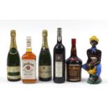 Six bottles of alcohol including Jim Beam whiskey, Tia Maria and Charles Heidsieck Champagne