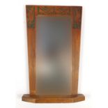Art Deco Rowley gallery style walnut wall mirror having a bevelled plate, carved with stylised