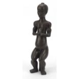 Tribal interest bronze figure of a nude male, impressed BC to the reverse, 38cm high