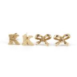 Two pairs of 9ct gold stud earrings, the largest 1cm in length, 1.8g