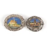 Two 19th century Continental oval hand painted ivory miniatures housed in silver filigree brooch