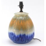 Ruskin pottery table lamp having a green, orange and blue dripping glaze, dated 1932, 30cm high