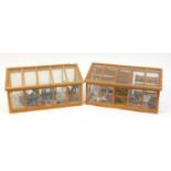 Two hand built wooden doll's house conservatories with contents, each 25cm H x 52cm W x 23cm D