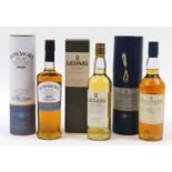 Three bottles of whiskey with boxes comprising Talisker aged 10 years, Ledaig Single Malt and