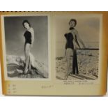 Vintage black and white photographs of pin up girls, mostly signed or with autographs, arranged in