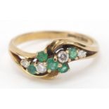 9ct gold emerald and diamond crossover ring, size O, 2.5g