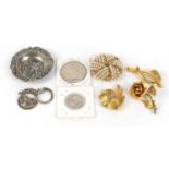 Objects including a Dutch silver ashtray, costume jewellery brooches, silver coins and a silver