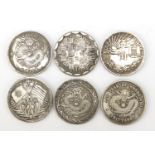 Six Chinese silver coloured metal coins