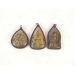 Three Asian/Tibetan buddhist shrines housed in silver coloured metal pendant mounts, the largest 7.