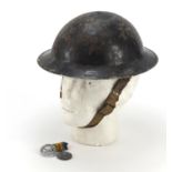 British militaria comprising 1914-18 war medal, Air Training Corps cap badge and a tin helmet, the