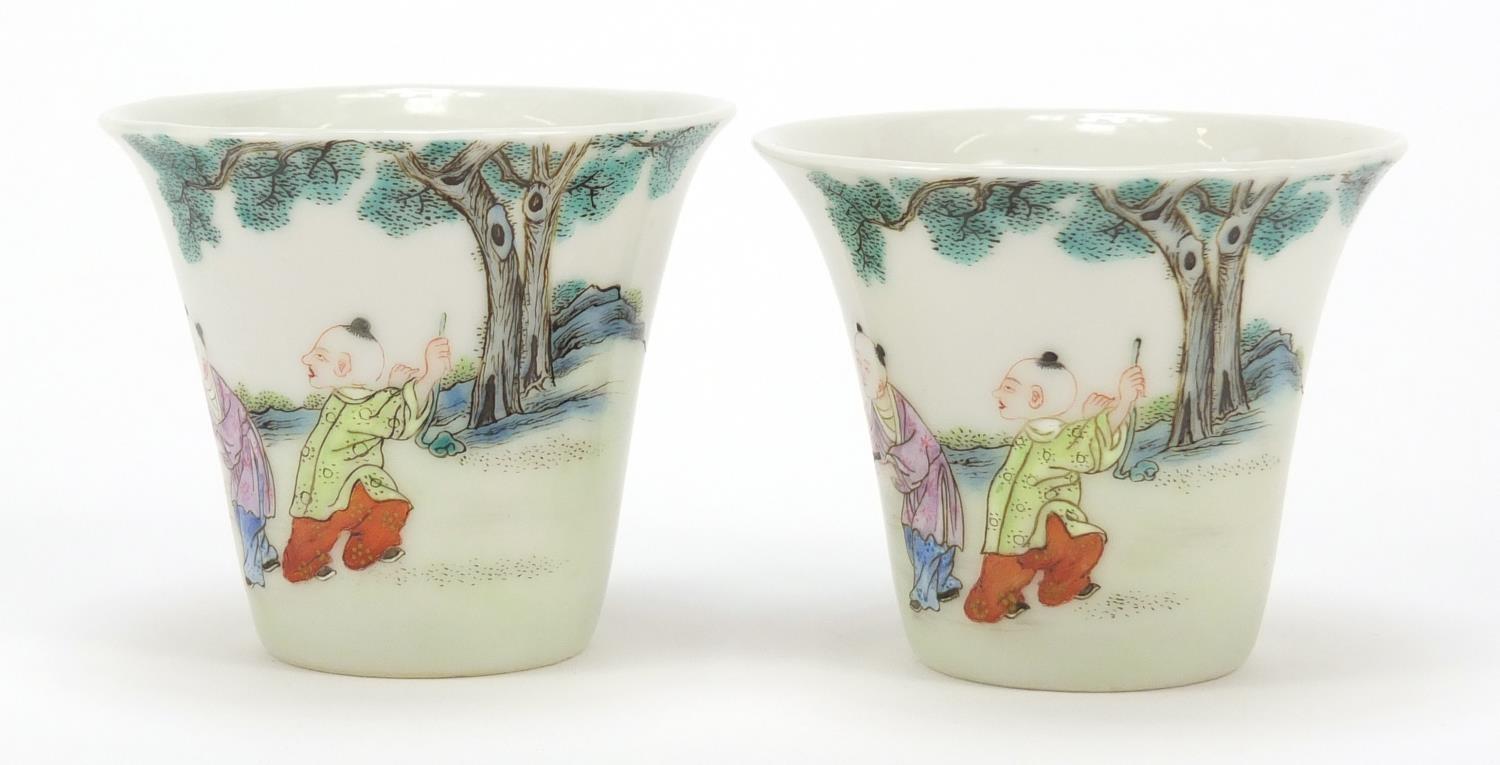 Good pair of Chinese porcelain tea cups hand painted in the famille rose palette with children - Image 4 of 11