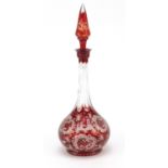 Bohemian ruby glass decanter etched with wild animals and flowers, 34.5cm high