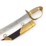 Georgian British military sword with ivory grip and scabbard, the engraved steel blade having