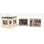Three hand built wooden doll's house dioramas with contents, the largest 26cm H x 32cm W x 32cm D
