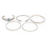 Four silver bracelets including one set with a cabochon turquoise stone, 45.0g
