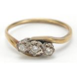 9ct gold diamond three stone crossover ring, size O, 2.2g