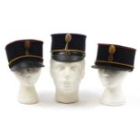 Three Dutch military interest Kepis caps, each with stamps/inscriptions to the interiors