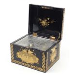 Large Chinese black lacquered tea caddy with engraved pewter liner, finely gilded with panels of
