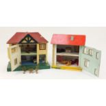 Two vintage hand built wooden and tinplate doll's houses with contents, each 40cm high