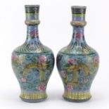 Pair of large Chinese porcelain vases, finely hand painted with dragons amongst flower heads and