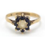 9ct gold sapphire and clear stone flower head ring, size M, 1.8g