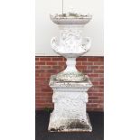 Very large cast iron Campana shaped urn and cover on stand with twin handles raised on square