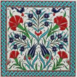 Turkish Kutahya tile enamelled with flowers, housed in a stained wood frame, the tile 20cm x 20cm