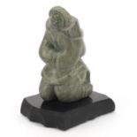 Annie Qimirpik, Canadian Inuit Steatite stone carving of a woman, raised on black slate plinth base,