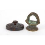 Two intaglio seals including a bronze example, the largest 2.5cm high
