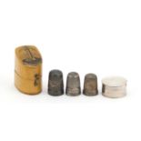 Three silver thimbles, circular silver pill box and a Mauchlin ware thimble box, various