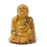 Turkish Canakkale pottery figure of a man having a yellow and brown glaze, 15.5cm high