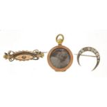 Two Victorian gold coloured metal brooches and a locket, the largest 4.1cm wide