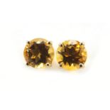 Pair of 9ct gold orange stone stud earrings, 5.8mm in diameter, 1.1g
